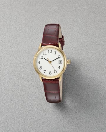 Gold watch with a red-brown leather strap, product photo